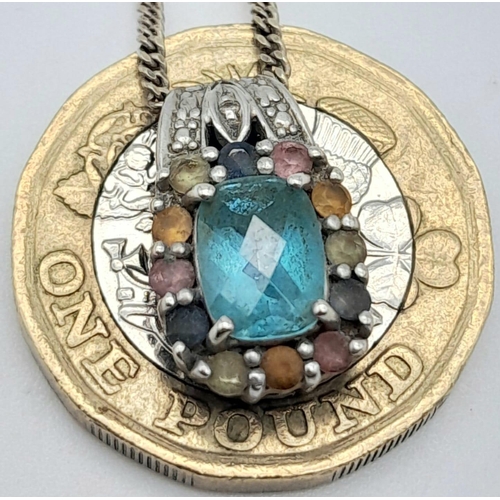 27 - A vintage 9K white gold multi-colour Topaz pendant on 9k gold chain. Total weight 4.3G. Total length... 