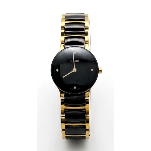 361 - A Rado Centrix Quartz Diamond Watch. Ceramic and gold tone bracelet. Case - 23mm. Black dial with fo... 