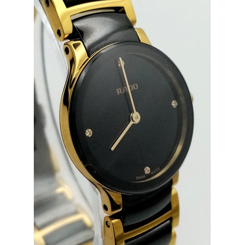 361 - A Rado Centrix Quartz Diamond Watch. Ceramic and gold tone bracelet. Case - 23mm. Black dial with fo... 