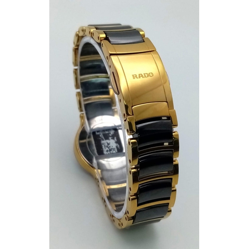 361 - A Rado Centrix Quartz Diamond Watch. Ceramic and gold tone bracelet. Case - 23mm. Black dial with fo... 