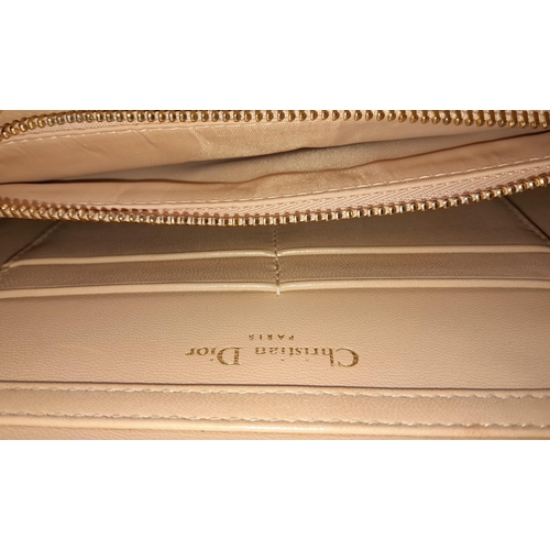 382 - A Christian Dior Blush Leather Small Handbag. Decorative leather with rose gold tone furniture. Zipp... 