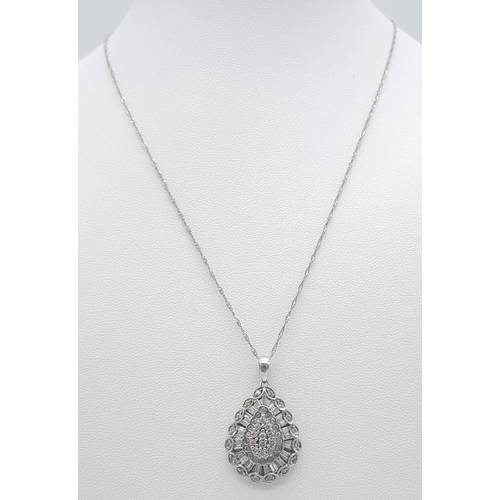 41 - A fancy 9K white gold and 1ct diamond Pear shape cluster pendant on 9K white gold chain. Total weigh... 