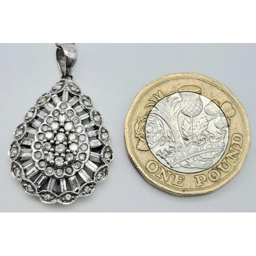 41 - A fancy 9K white gold and 1ct diamond Pear shape cluster pendant on 9K white gold chain. Total weigh... 