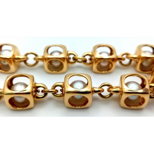 459 - A Designer (Gio Caroli) 18K Yellow Gold and Pearl Bracelet. Nine beautiful South Sea pearls - each e... 