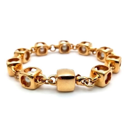 459 - A Designer (Gio Caroli) 18K Yellow Gold and Pearl Bracelet. Nine beautiful South Sea pearls - each e... 