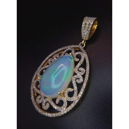 528 - A 10ct Colour-Play Opal Gemstone Pendant with 0.84ctw of Diamond Accents. Set in 925 Silver. Comes w... 