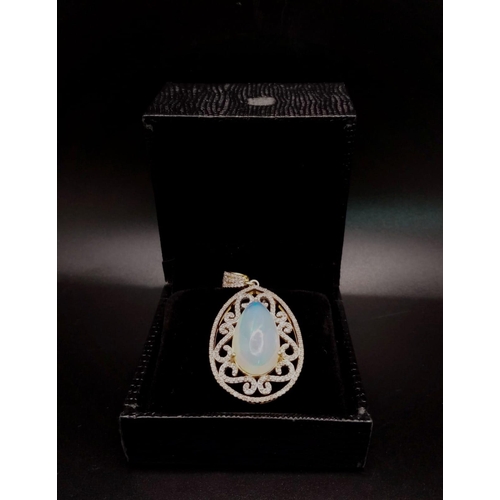 528 - A 10ct Colour-Play Opal Gemstone Pendant with 0.84ctw of Diamond Accents. Set in 925 Silver. Comes w... 