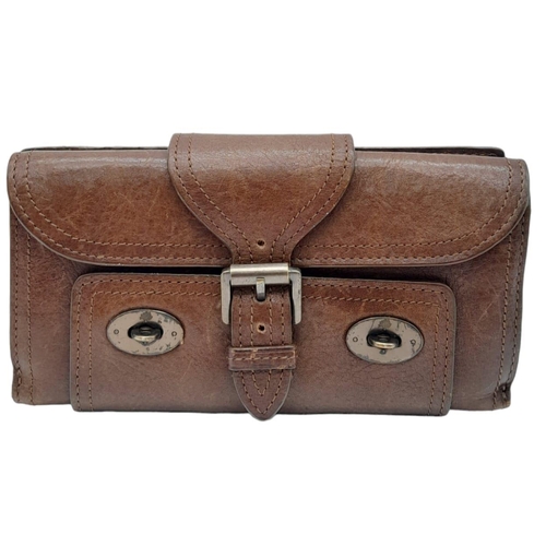 537 - A Brown Leather Mulberry Wallet. Exterior Fancy Buckle fastener. Plenty of interior space. 18cm x 10... 