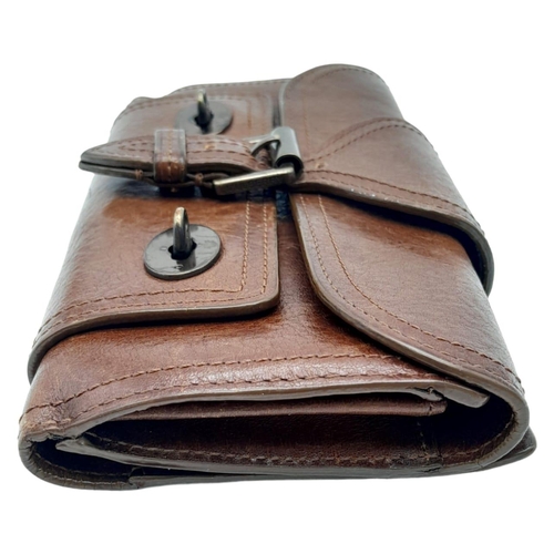 537 - A Brown Leather Mulberry Wallet. Exterior Fancy Buckle fastener. Plenty of interior space. 18cm x 10... 