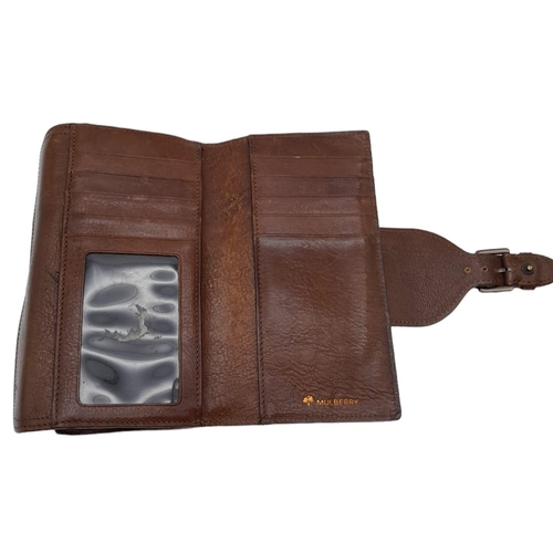 537 - A Brown Leather Mulberry Wallet. Exterior Fancy Buckle fastener. Plenty of interior space. 18cm x 10... 