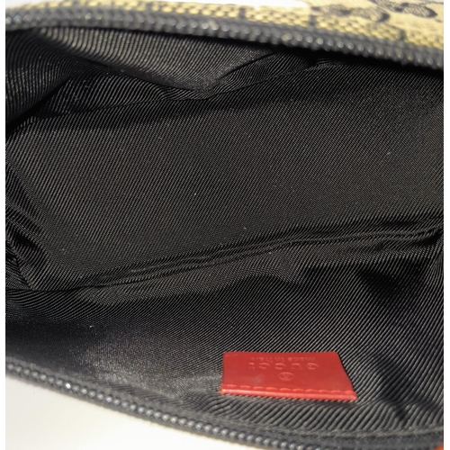 557 - A Gucci Monogram Hobo Cloth Mini Bag. 24cm by 11cm. In good condition but please see photos. Ref: 15... 