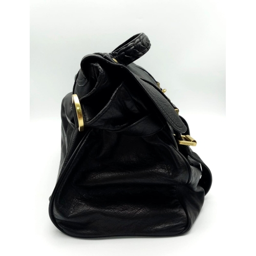 667 - A Mulberry Black Leather Alexa Handbag. Double buckle closure. Gilded hardware. Spacious interior wi... 