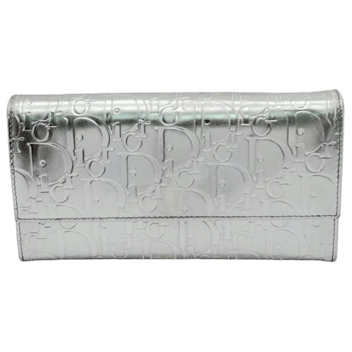 675 - A Christian Dior Metallic Tone Monogram Clutch Bag. Comes with dust cover. 19cm x 11cm. Please see p... 