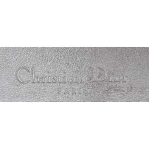 675 - A Christian Dior Metallic Tone Monogram Clutch Bag. Comes with dust cover. 19cm x 11cm. Please see p... 