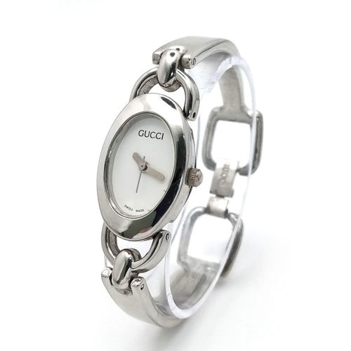 A vintage Gucci Ladies Watch. This delightful watch with 12mm oval dial is quality with a bracelet l