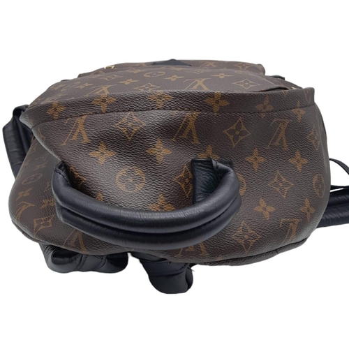 93 - A Louis Vuitton Palm Springs Backpack. LV monogram canvas exterior with a zipped compartment and pad... 