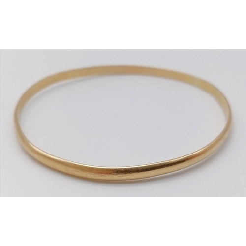 348 - A 9K Yellow Gold (tested) Large Bangle. 7cm inner diameter. 
13.05g weight.