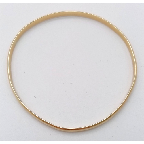 348 - A 9K Yellow Gold (tested) Large Bangle. 7cm inner diameter. 
13.05g weight.