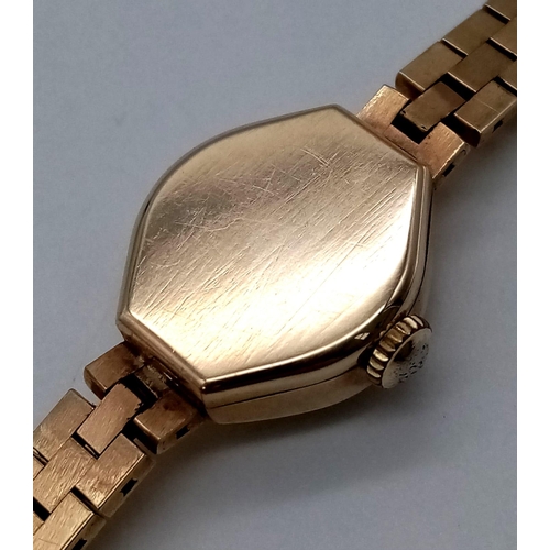 411 - An Accurist 21 Jewel 9K Gold Ladies Watch. 9K gold bracelet and case - 15mm. White dial. Mechanical ... 