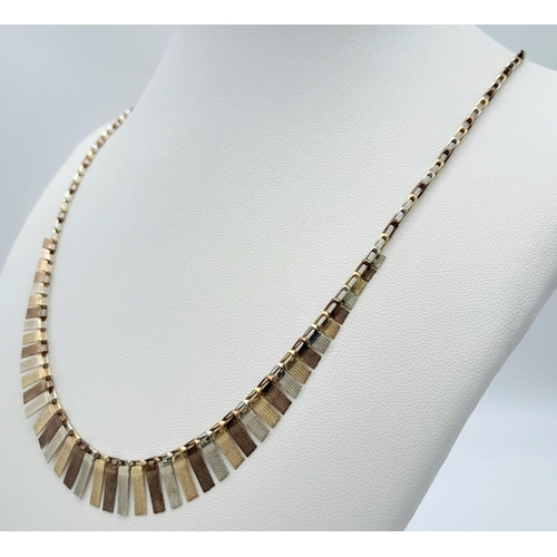 412 - A Vintage 9K Tri-Colour Gold Necklace. Graduating flaps of three coloured gold. 46cm. 7.88g weight.