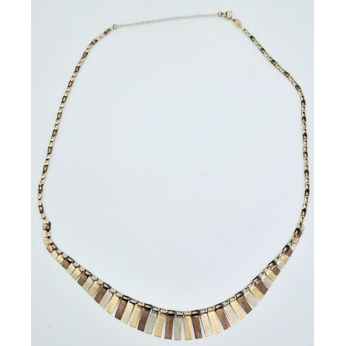 412 - A Vintage 9K Tri-Colour Gold Necklace. Graduating flaps of three coloured gold. 46cm. 7.88g weight.