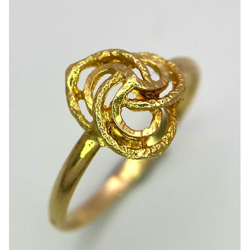 490 - An 18K Yellow Gold Knot Motif Ring. Size L. 1.37g weight.