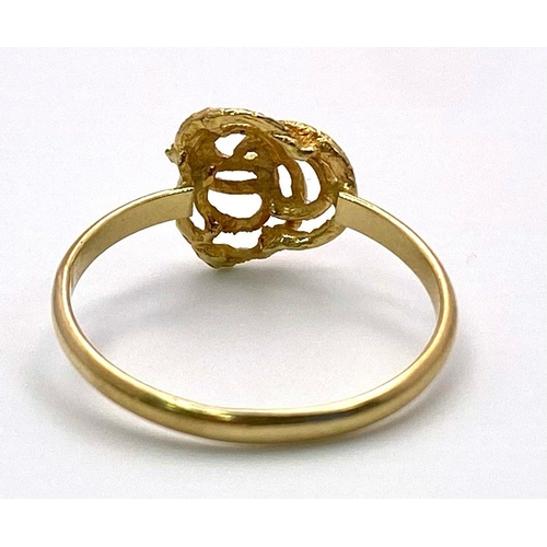 490 - An 18K Yellow Gold Knot Motif Ring. Size L. 1.37g weight.