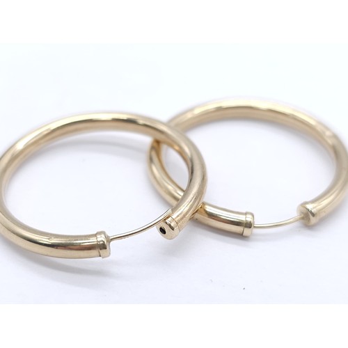 446 - A Pair of Classic 9K (tested) Yellow Gold Hoop Earrings. 1.65g total weight.