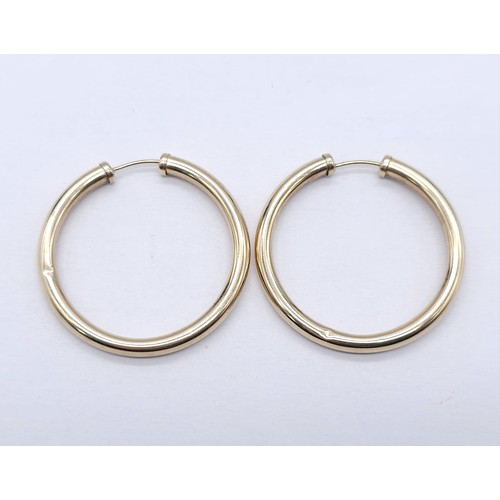 446 - A Pair of Classic 9K (tested) Yellow Gold Hoop Earrings. 1.65g total weight.