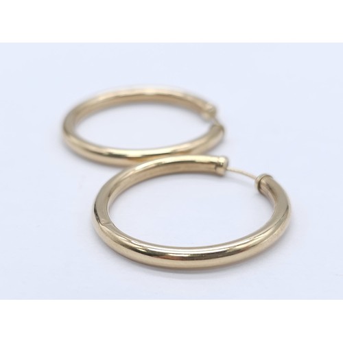 446 - A Pair of Classic 9K (tested) Yellow Gold Hoop Earrings. 1.65g total weight.