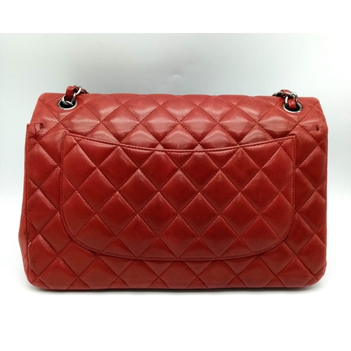 150 - A Chanel Red Quilted Caviar Double Flap Jumbo Bag. Diamond quilted exterior with CC logo clasp. Larg... 