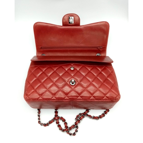 150 - A Chanel Red Quilted Caviar Double Flap Jumbo Bag. Diamond quilted exterior with CC logo clasp. Larg... 