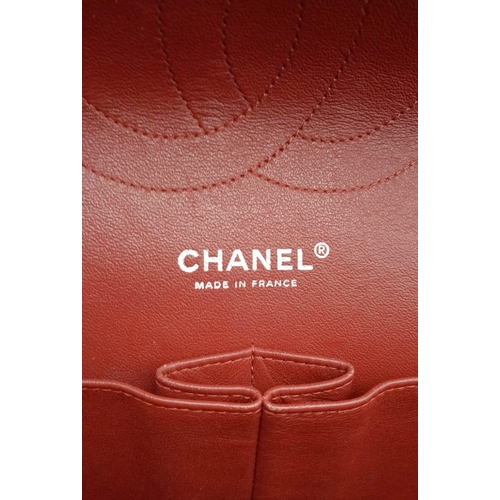 150 - A Chanel Red Quilted Caviar Double Flap Jumbo Bag. Diamond quilted exterior with CC logo clasp. Larg... 