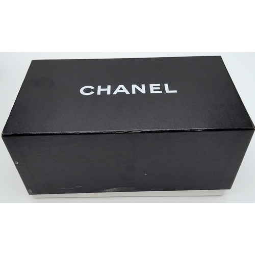 277 - A Pair of Chanel Sunglasses. Comes with case and Chanel box. In good condition. Ref: 15400