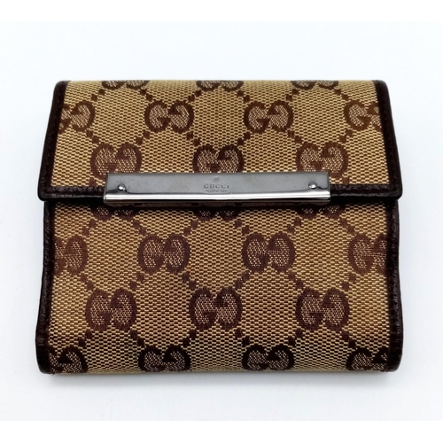 316 - A Gucci Monogram Canvas Wallet. Comes with a Gucci box. 10cm x 9cm. Ref: 15399