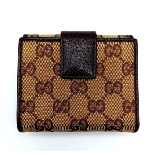 316 - A Gucci Monogram Canvas Wallet. Comes with a Gucci box. 10cm x 9cm. Ref: 15399