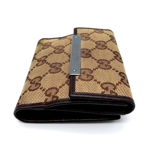 316 - A Gucci Monogram Canvas Wallet. Comes with a Gucci box. 10cm x 9cm. Ref: 15399