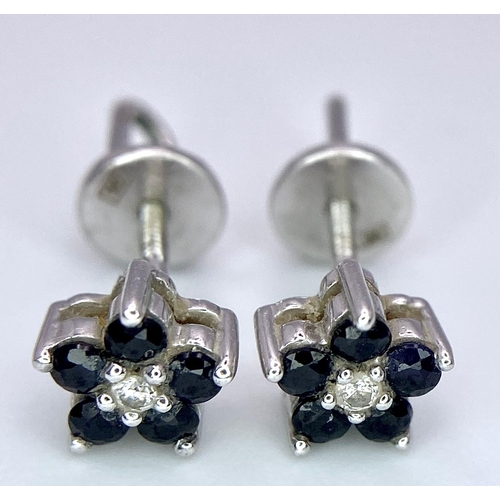 506 - A Pair of 14K White Gold, Sapphire and Diamond Stud Earrings. 1.41g total weight.