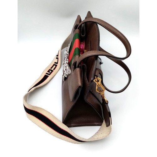 51 - A Gucci Linea Butterfly Clasp Satchel. Brown calfskin leather exterior with decorative white stone b... 