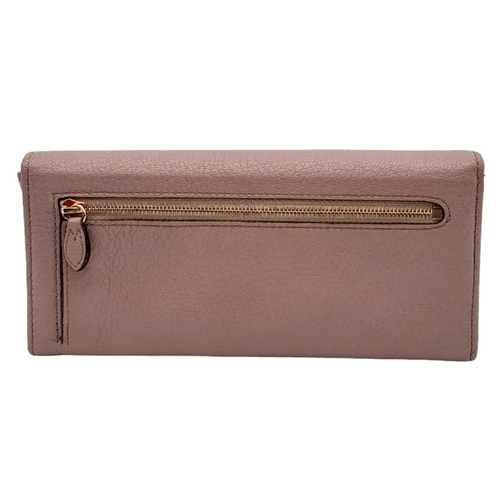 611 - A Mulberry Deep Pink Wallet. 19cm width by 9cm height. Comes with a Mulberry case. Ref: 15402