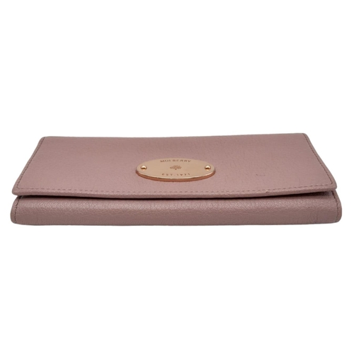 611 - A Mulberry Deep Pink Wallet. 19cm width by 9cm height. Comes with a Mulberry case. Ref: 15402