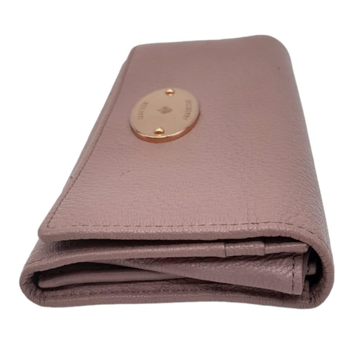 611 - A Mulberry Deep Pink Wallet. 19cm width by 9cm height. Comes with a Mulberry case. Ref: 15402