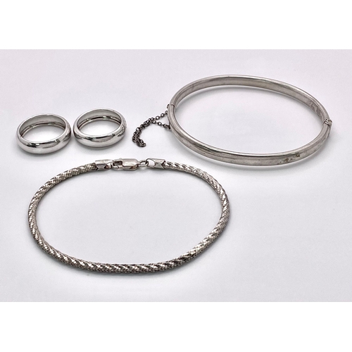 854 - A parcel of Sterling Silver Jewellery.
Includes two rings (both Size N), a bracelet (19.5cm) and a h... 