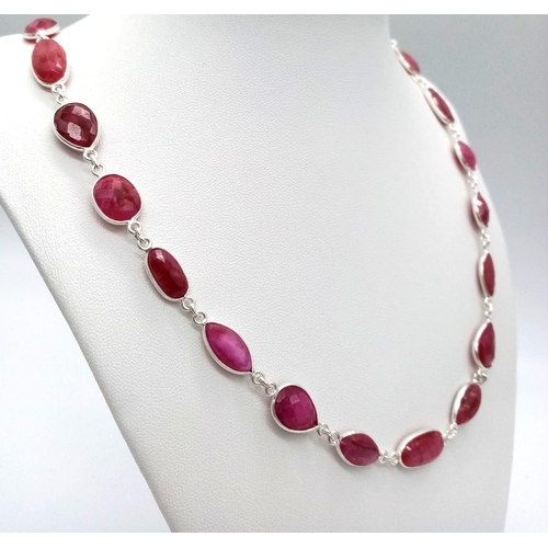 605B - A stunning Ruby gemstone long chain necklace, set in Sterling Silver. This stylish necklace measures... 