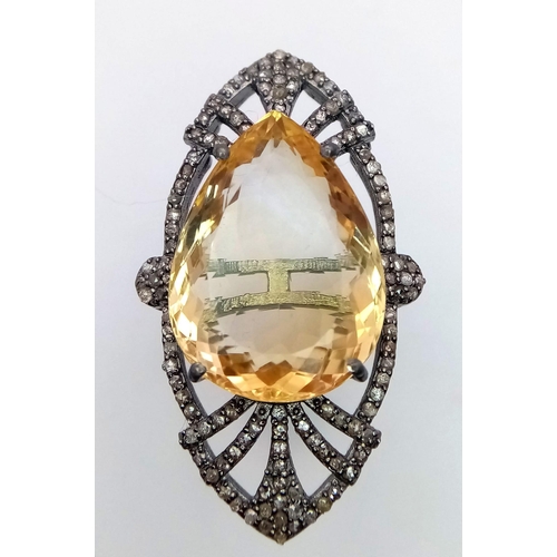 618B - An exquisite 24ct Citrine stone, framed by 1.10ctw of Diamonds and set on a 925 Sterling Silver.
Wei... 