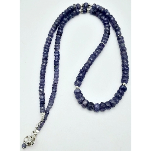 625B - A graduating Tanzanite gemstone beaded necklace with a 925 silver clasp. 120ctw, this necklace is su... 