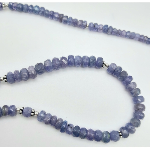 625B - A graduating Tanzanite gemstone beaded necklace with a 925 silver clasp. 120ctw, this necklace is su... 