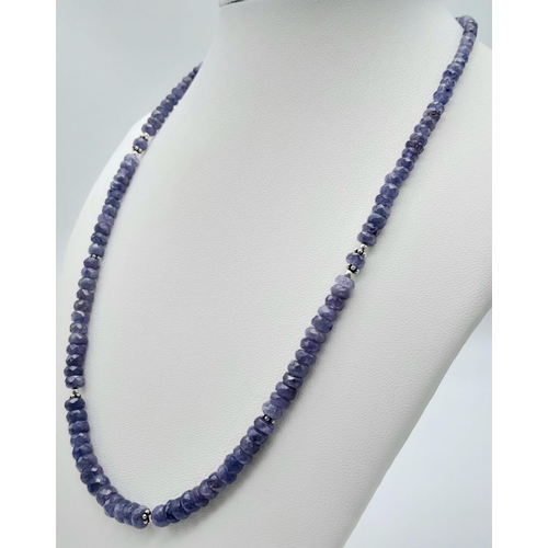 625B - A graduating Tanzanite gemstone beaded necklace with a 925 silver clasp. 120ctw, this necklace is su... 