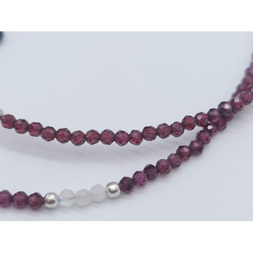 714B - A unique, Tourmaline & Garnet gemstone beaded necklace with a 925 Silver clasp.
Measuring 46cm in le... 