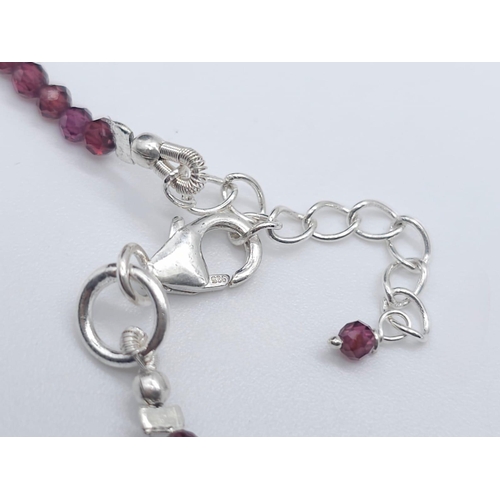 714B - A unique, Tourmaline & Garnet gemstone beaded necklace with a 925 Silver clasp.
Measuring 46cm in le... 